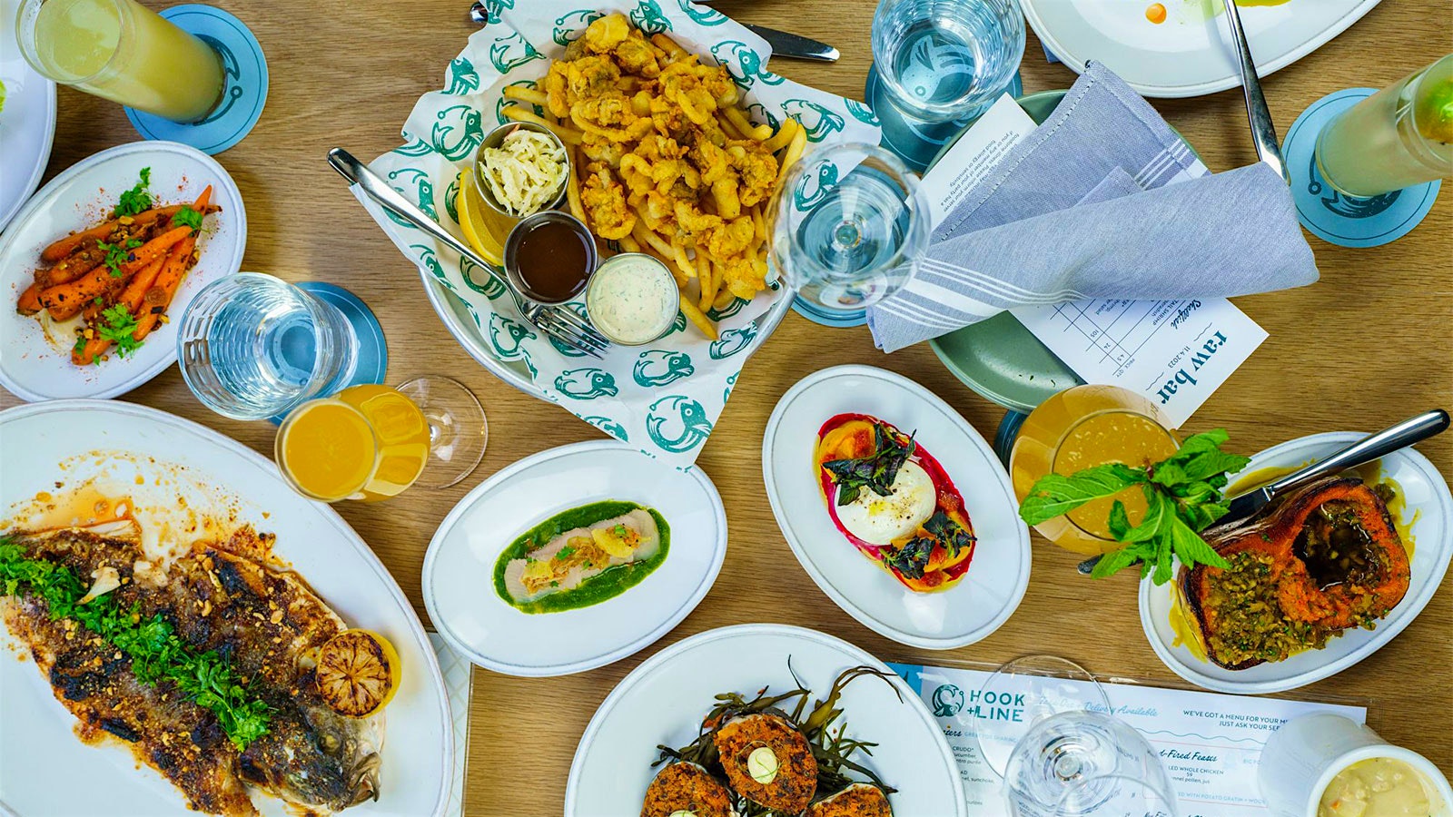  A table of fried calamari, grilled fish and baked clams