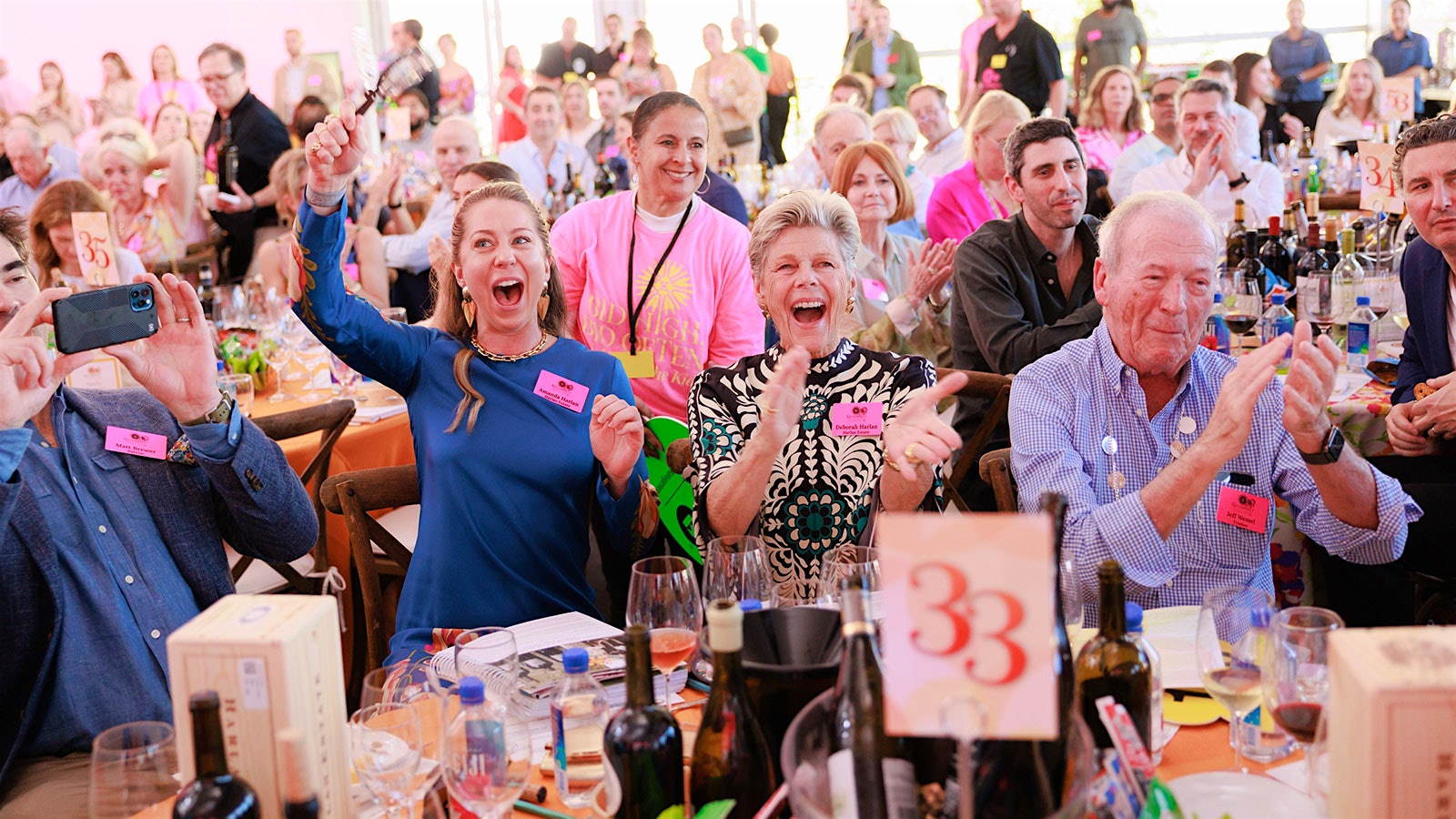  The crowd cheers the results at the Naples Winter Wine Festival