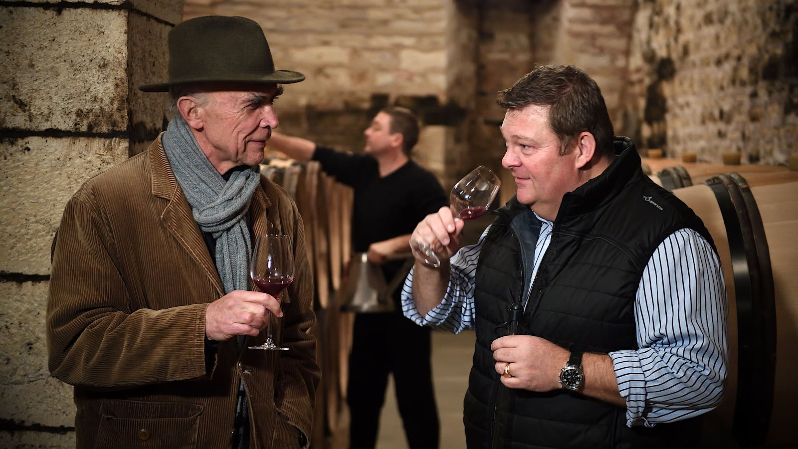 Domaine de la Romanée-Conti's Aubert de Villaine (left) and his nephew Bertrand de Villaine taste Pinot Noir in the cellar of DRC.