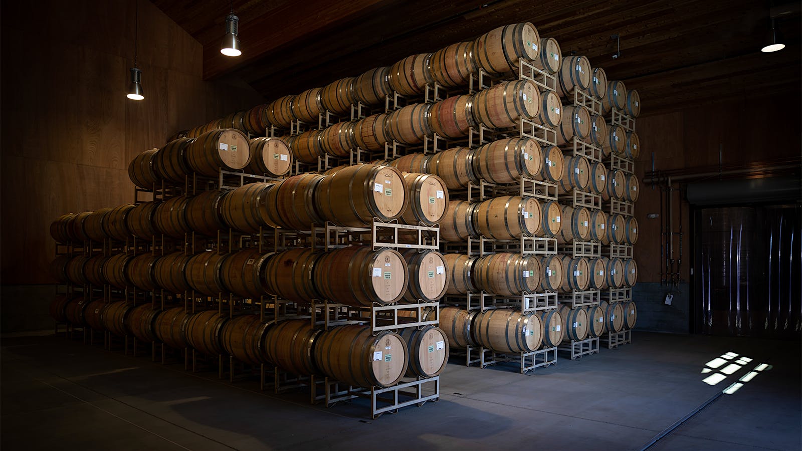 Barrels stacked in a barrel room at Sequoia Grove winery in Napa Valley, California