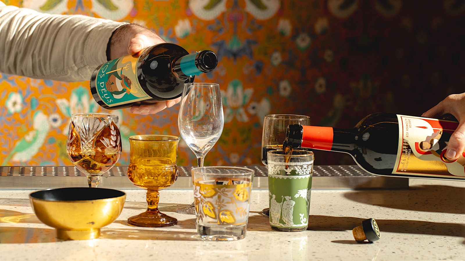  Servers pouring sweet and dry vermouth in an eclectic collection of cups