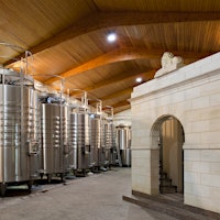 Stainless steel winemaking vats line the walls at Château Léoville Las Cases.Léoville Las Cases Takes the 2023 Bordeaux Stage—and Then the 2024 Wine Experience