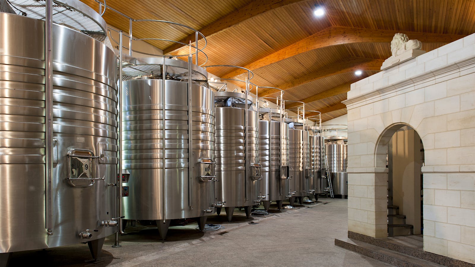 Stainless steel winemaking vats line the walls at Château Léoville Las Cases