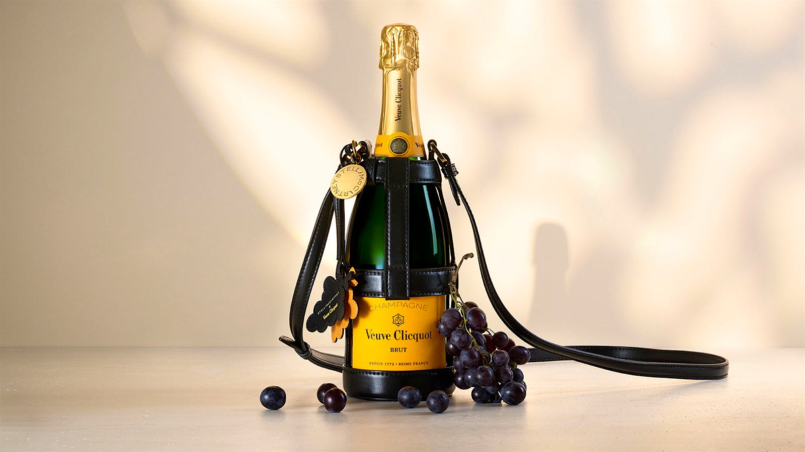 Created from vegan leather made from grape waste, a Champagne bottle holder wraps around a bottle of Veuve Clicquot