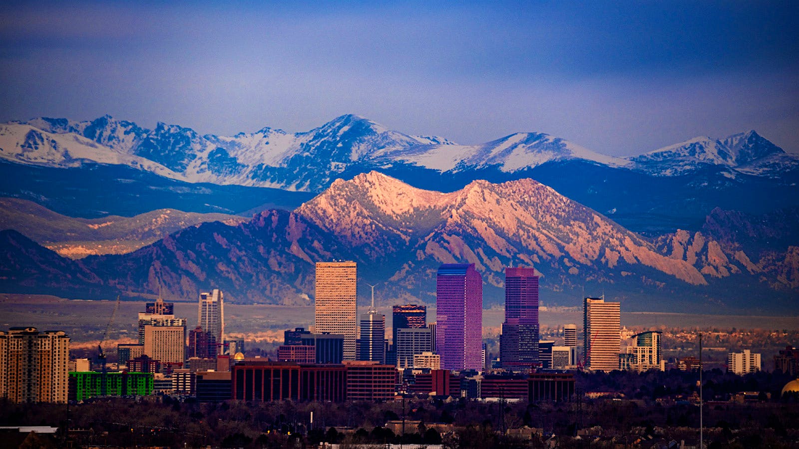 The Denver skyline with the Rocky Mountains in the background