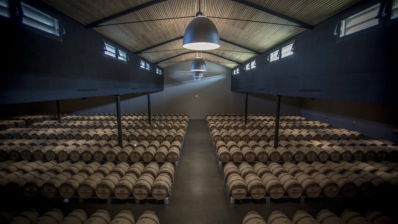 Château Palmer's wine barrel room in Bordeaux