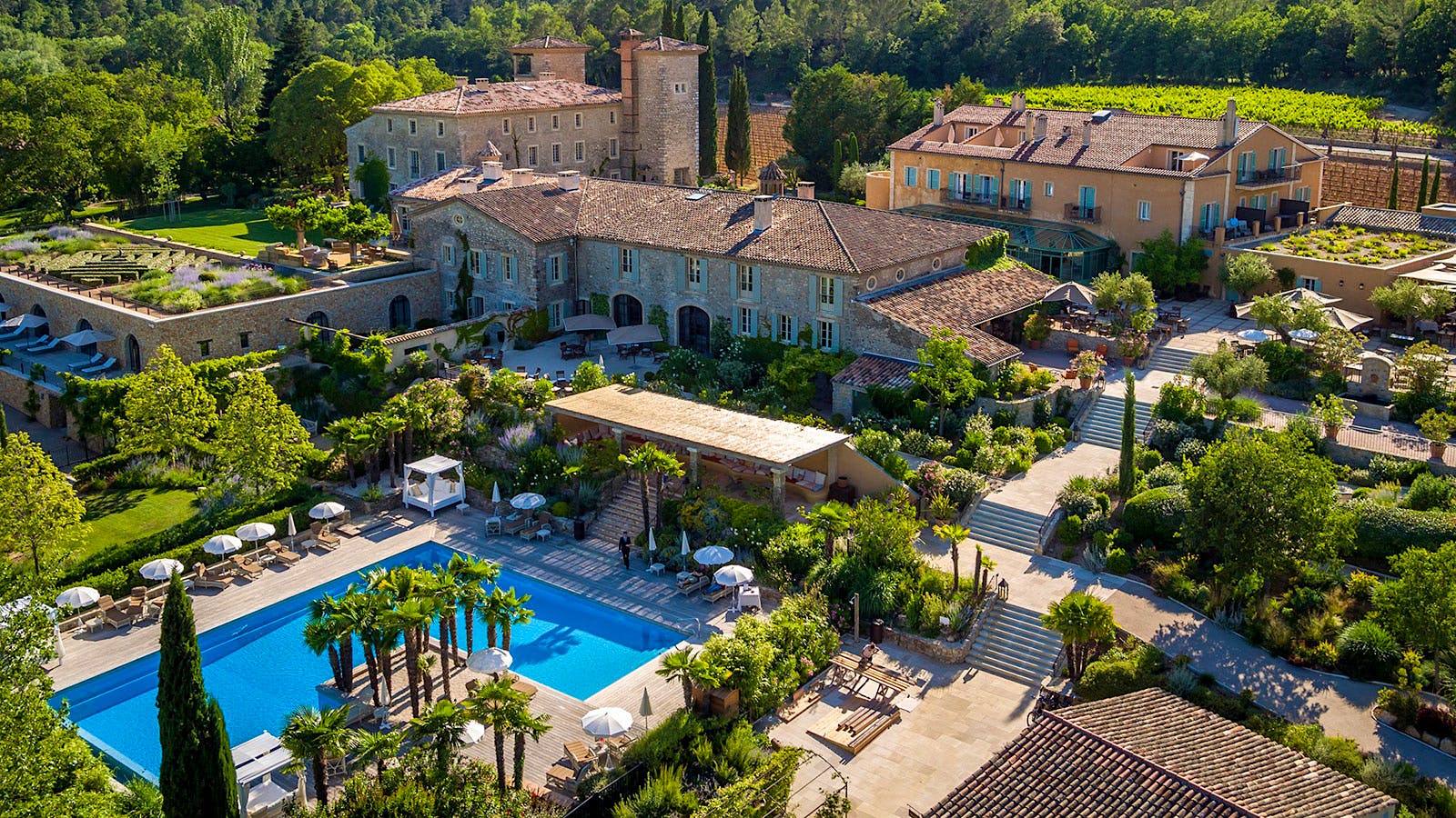 The Provence-style buildings and a pool at Château de Berne in France