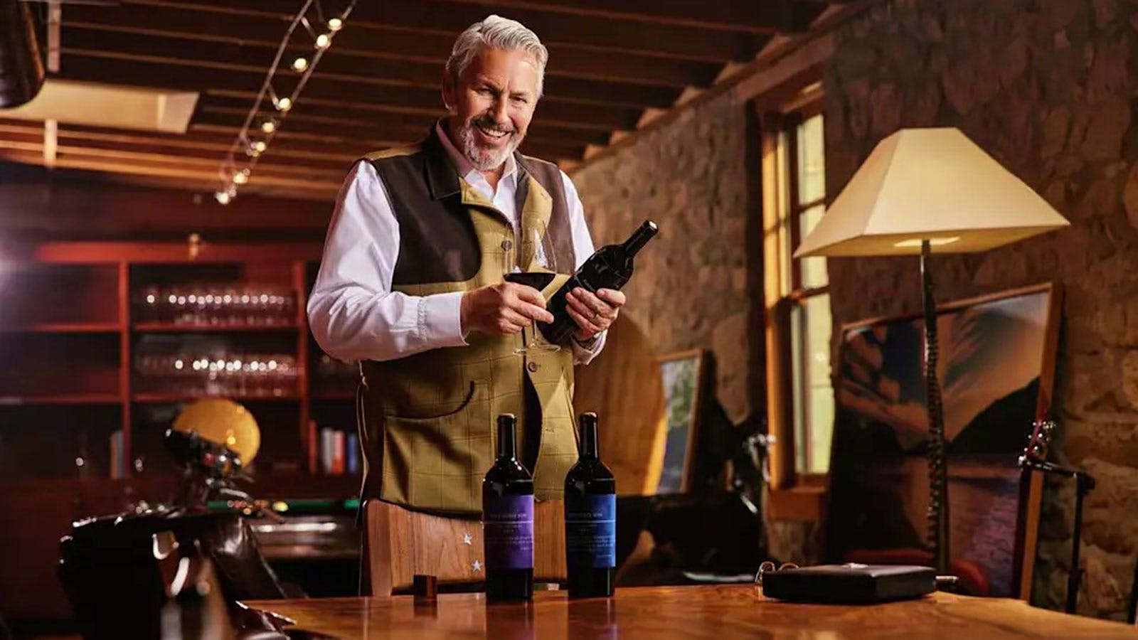 Jayson Woodbridge inspects bottles of wine at his Hundred Acre Wines tasting room in Napa Valley, California.