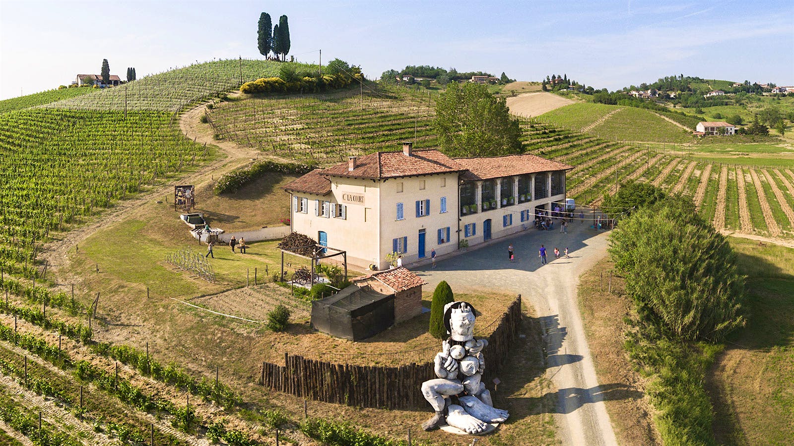 White buildings and hillside vineyards of Michele Chiarlo in Piedmont, Italy