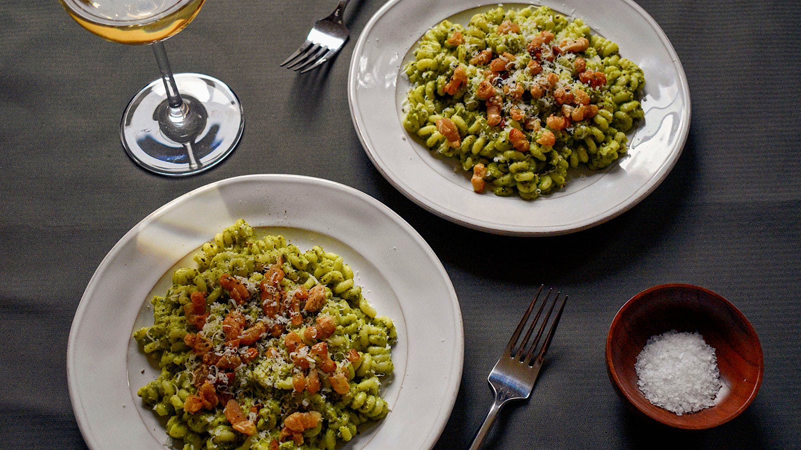 Kale and white been pasta with crispy white beans and a glass of Verdichio