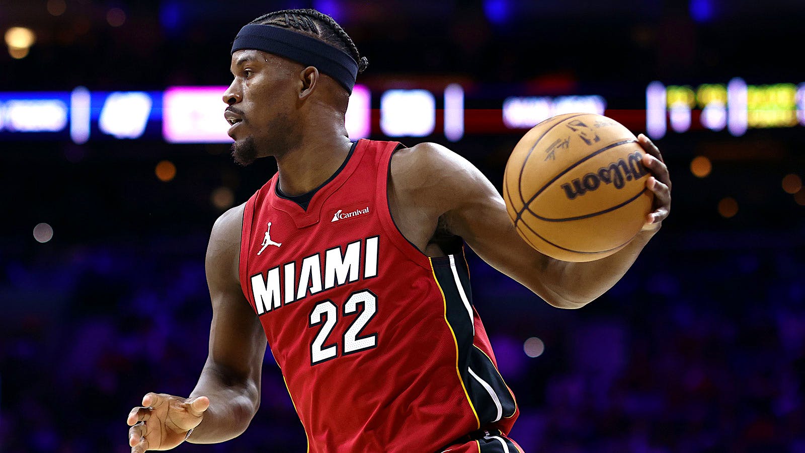 Jimmy Butler dribbles down the court during a basketball game for the Miami Heat