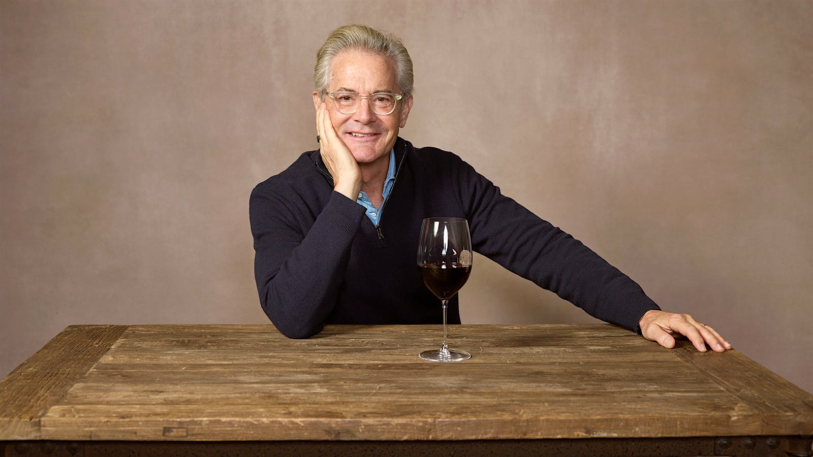 2024 New York Wine Experience wine star Kyle MacLachlan with a glass of red wine