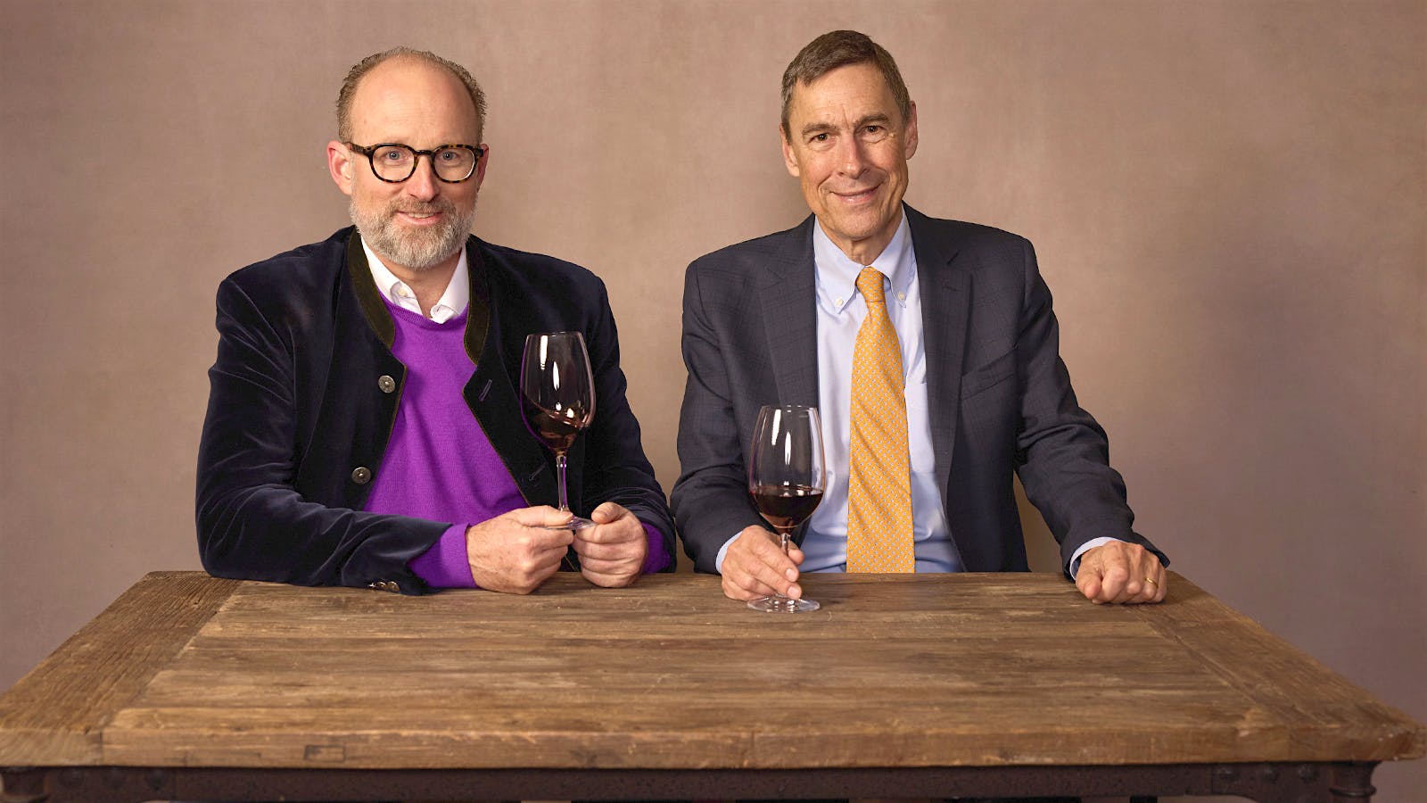 Prince Robert de Luxembourg and Wine Spectator executive editor emeritus Thomas Matthews sitting at a table with glasses of Château La Mission Haut-Brion 2000