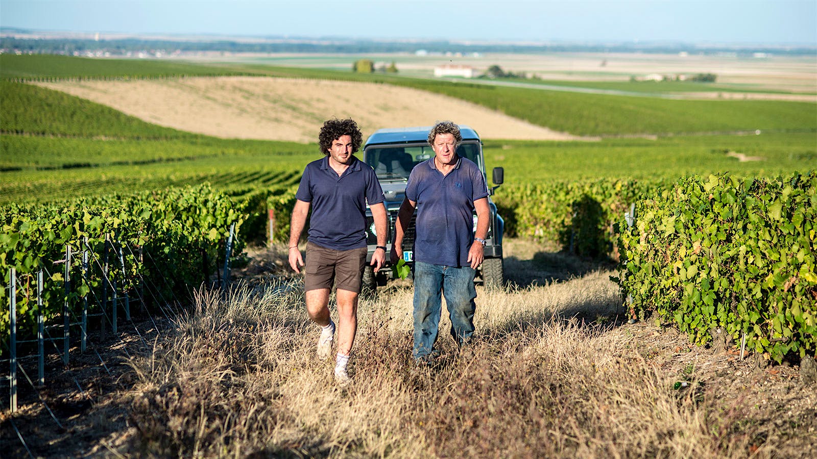 The Champagne Jacques Selosse son-and-father team of Guillaume (left) and Anselme Selosse walking in a vineyard