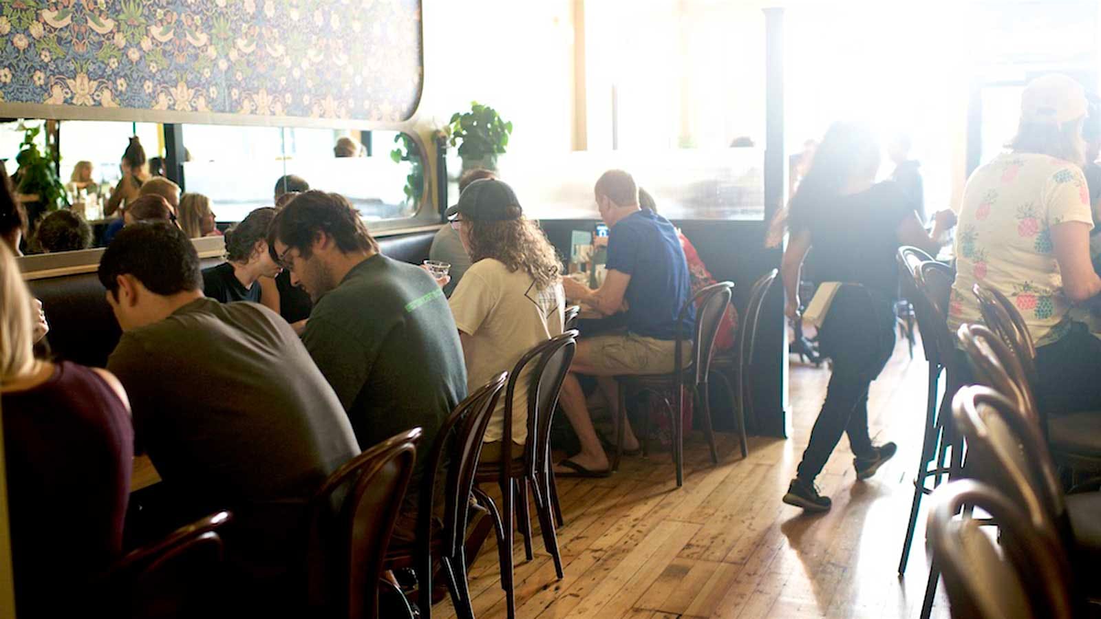 Guests in the dining room of Canard in Portland, Ore.