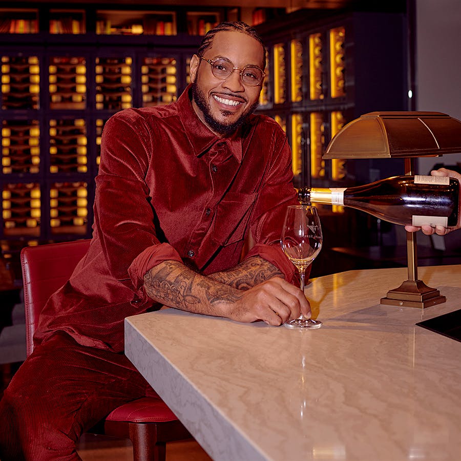 Carmelo Anthony with a glass of wine. Photo credit: Meron Menghistab