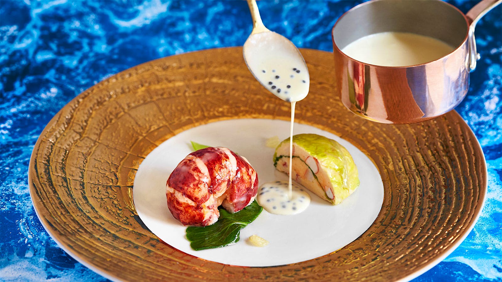 Cabbage wrapped lobster mousse with a lobster tail from the Inn at Little Washington in Virigina