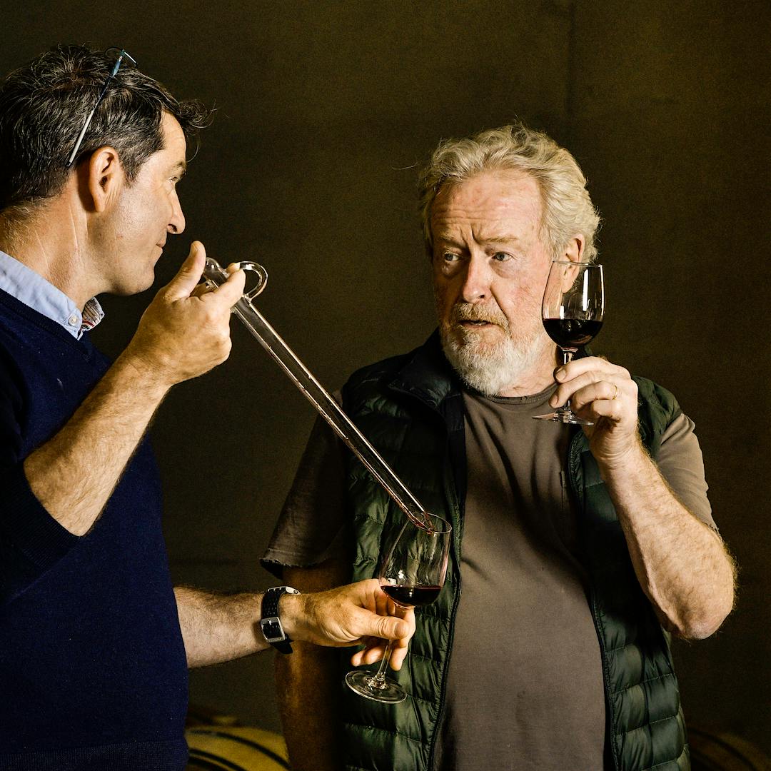 Filmmaker Ridley Scott (right) and Mas des Infermières estate director Christophe Barraud sample wine from barrel.