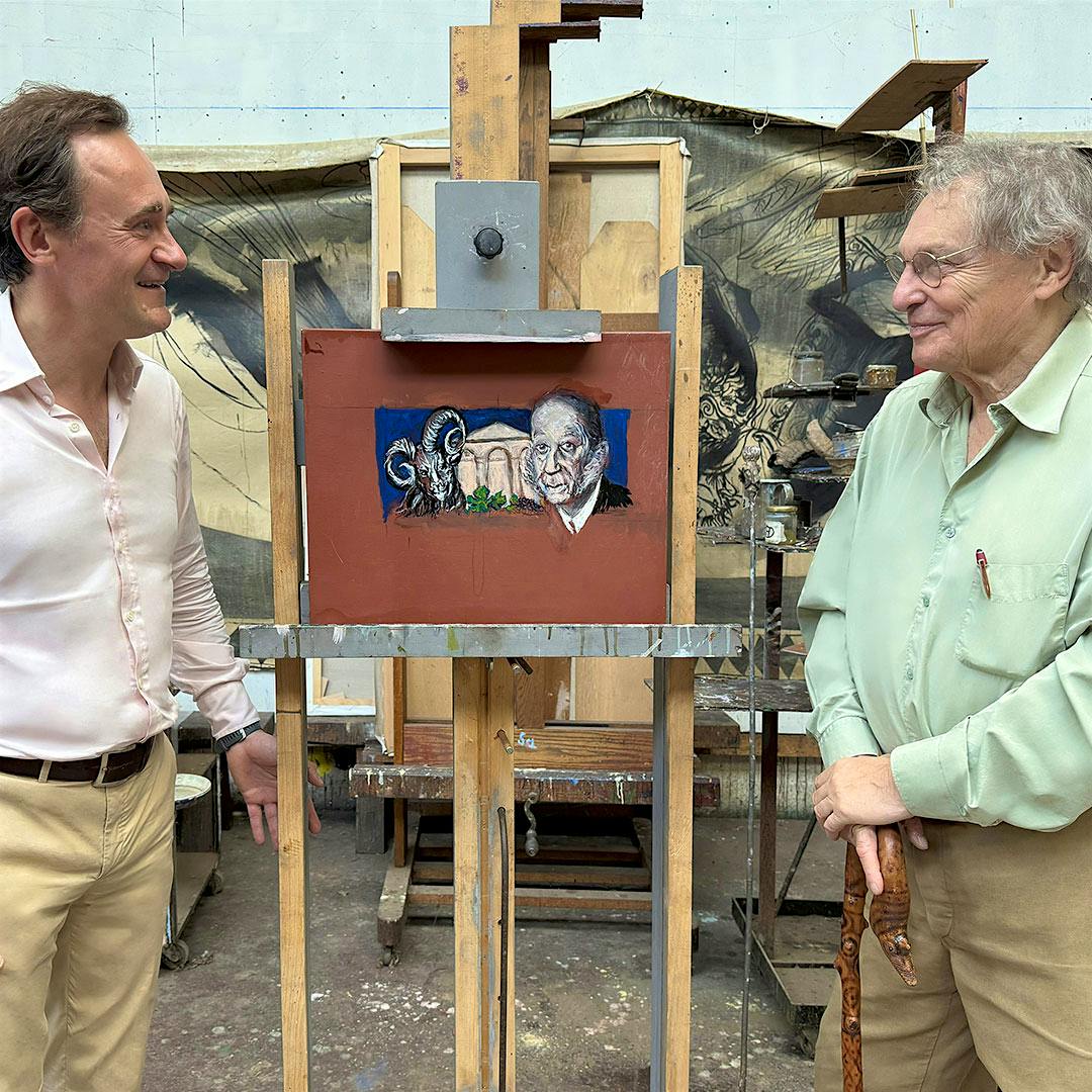 Julien de Beaumarchais de Rothschild, left, and Gérard Garouste look at the artist's painting for the 2022 Mouton-Rothschild vintage.