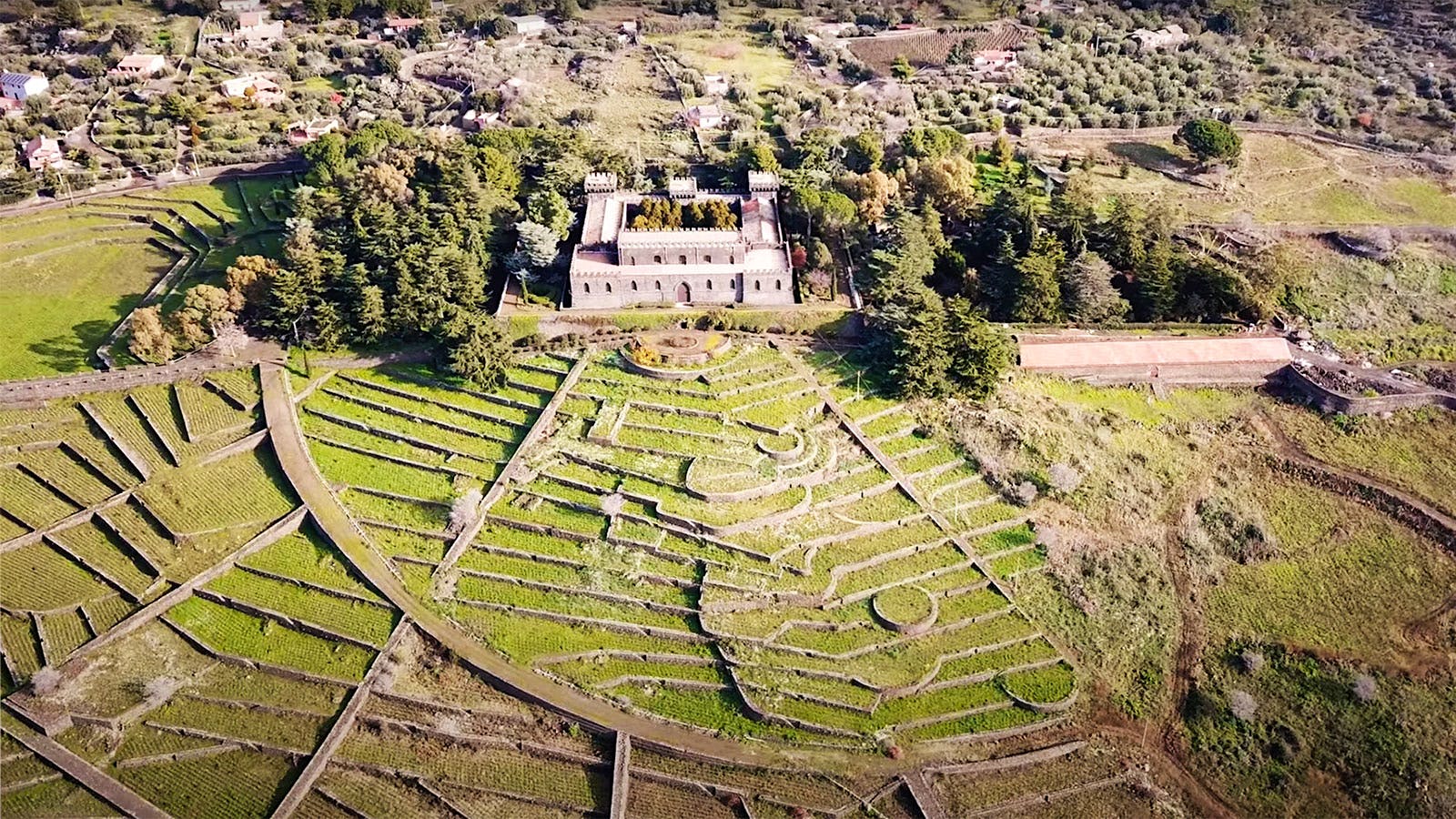  An aerial view of Castello Solicchiata&rsquo;s castle-like building and its terraced vineyards