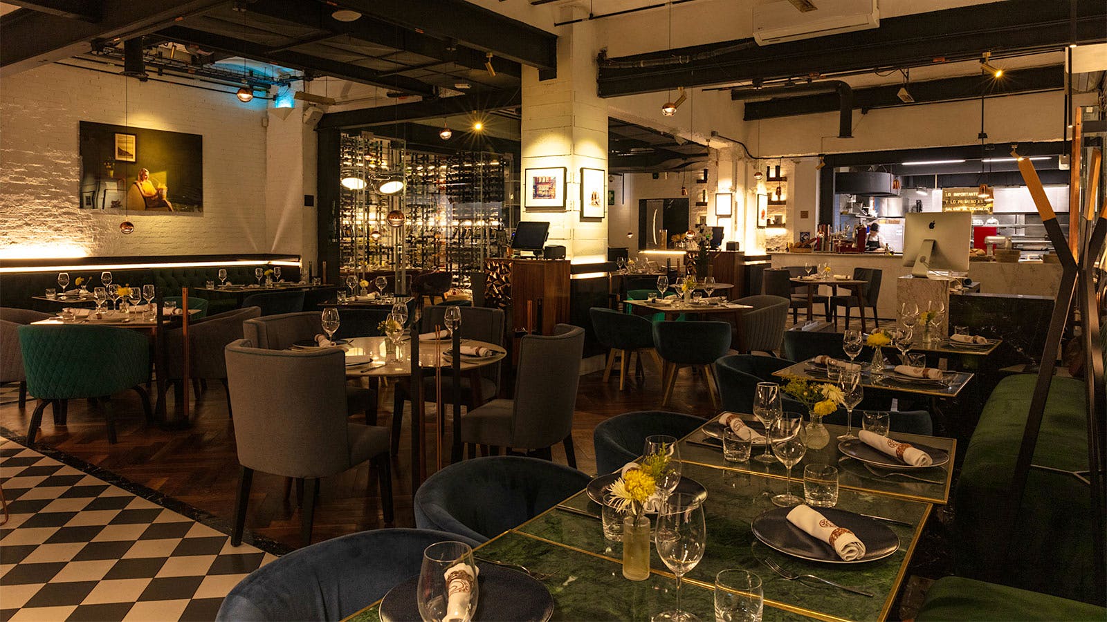  The dining room of Sepia in Mexico, with a glass-encased wine cellar in the background