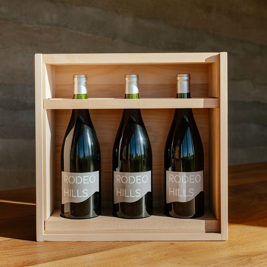  Three bottles of Rodeo Hills wines in a wood case