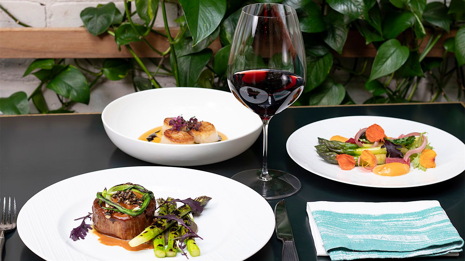  A selection of dishes and a glass of red wine from Annabelle DC in Washington, D.C.