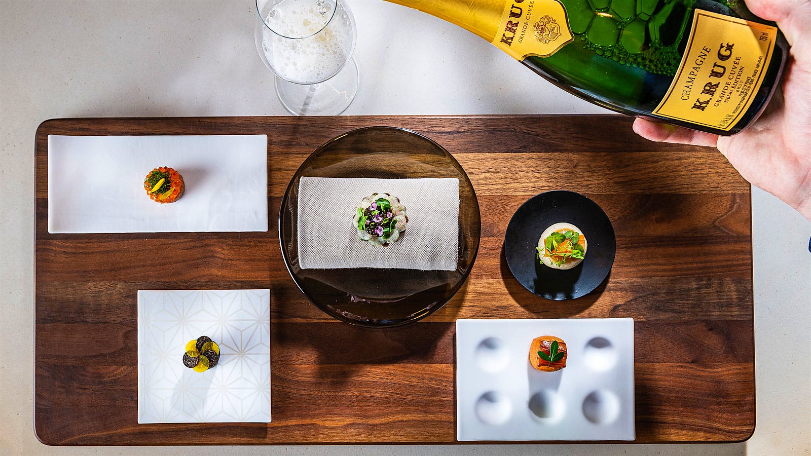  A series of amuse bouche from J&ocirc;nt in Washington, D.C. with a bottle of Krug Champagne