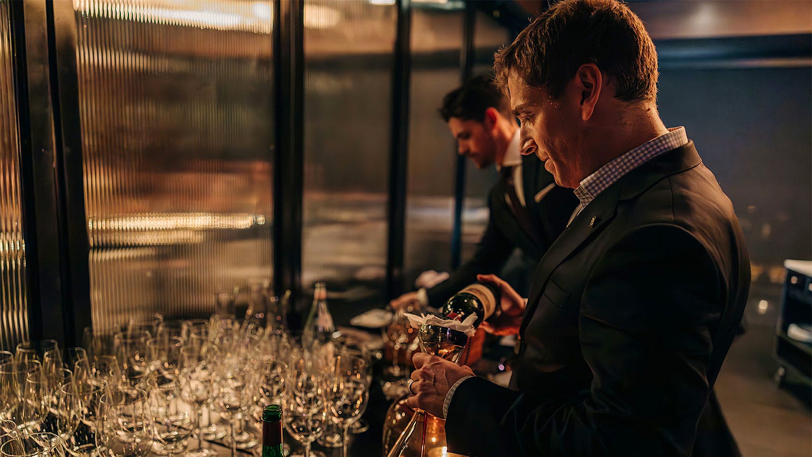  Sommeliers pouring wine into hundreds of glasses at RPM Italian in Washington, D.C.