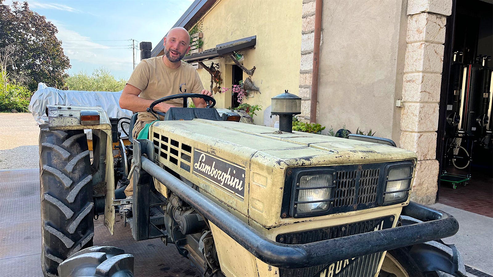  Enrico Gentili of Gentili estate on a Lamborghini tractor