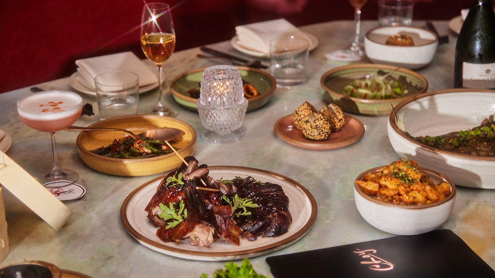  A selection of dishes and drinks, including glasses of wine, from Choy in Nashville