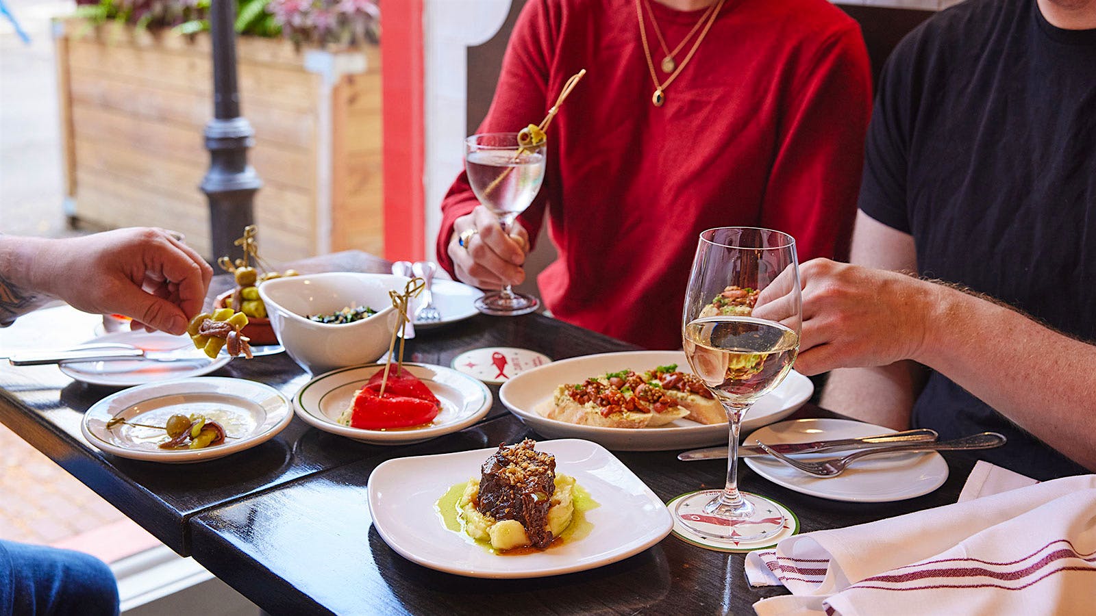  A selection of dishes and glasses of wine from Zurito in Boston