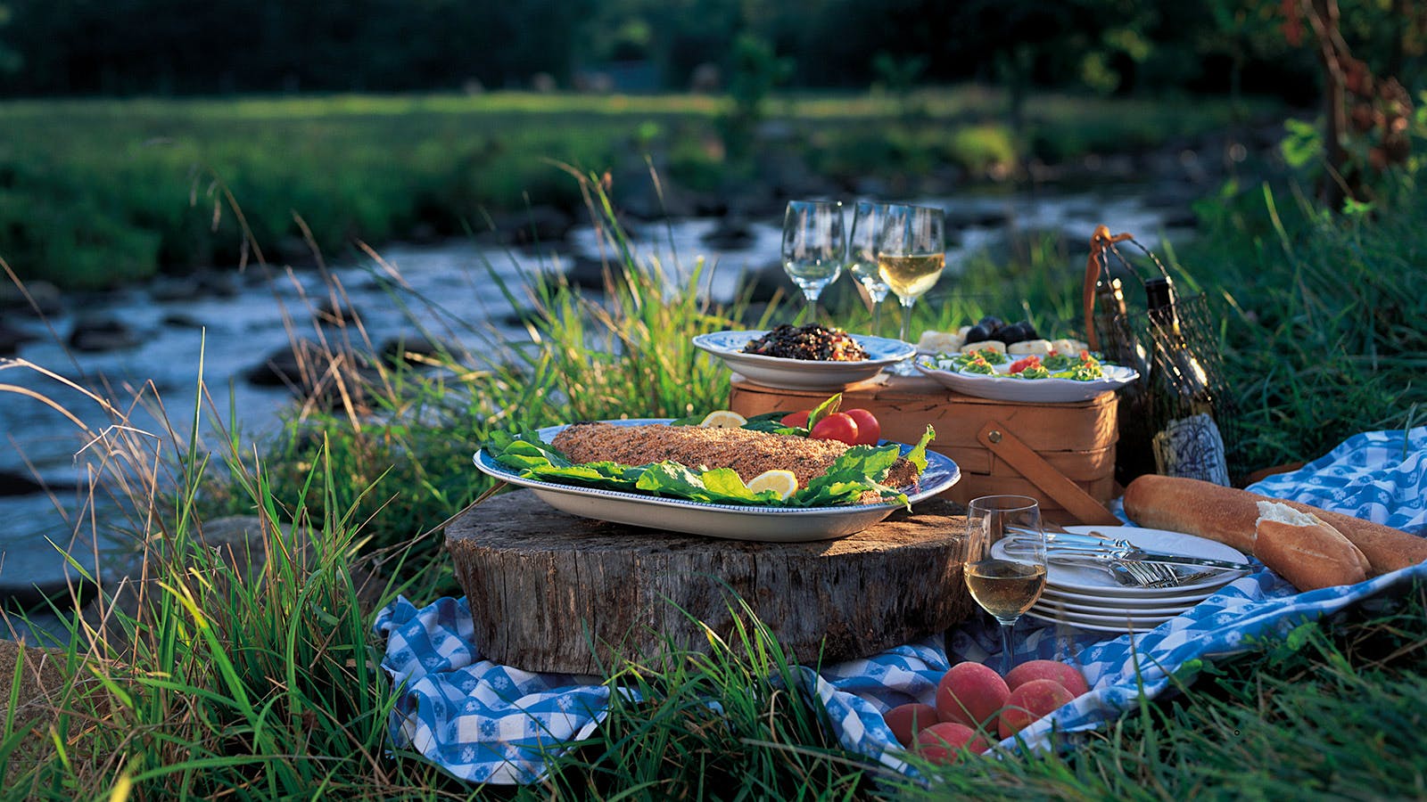 A picnic spread includes a full side of salmon in a mustard seed crust