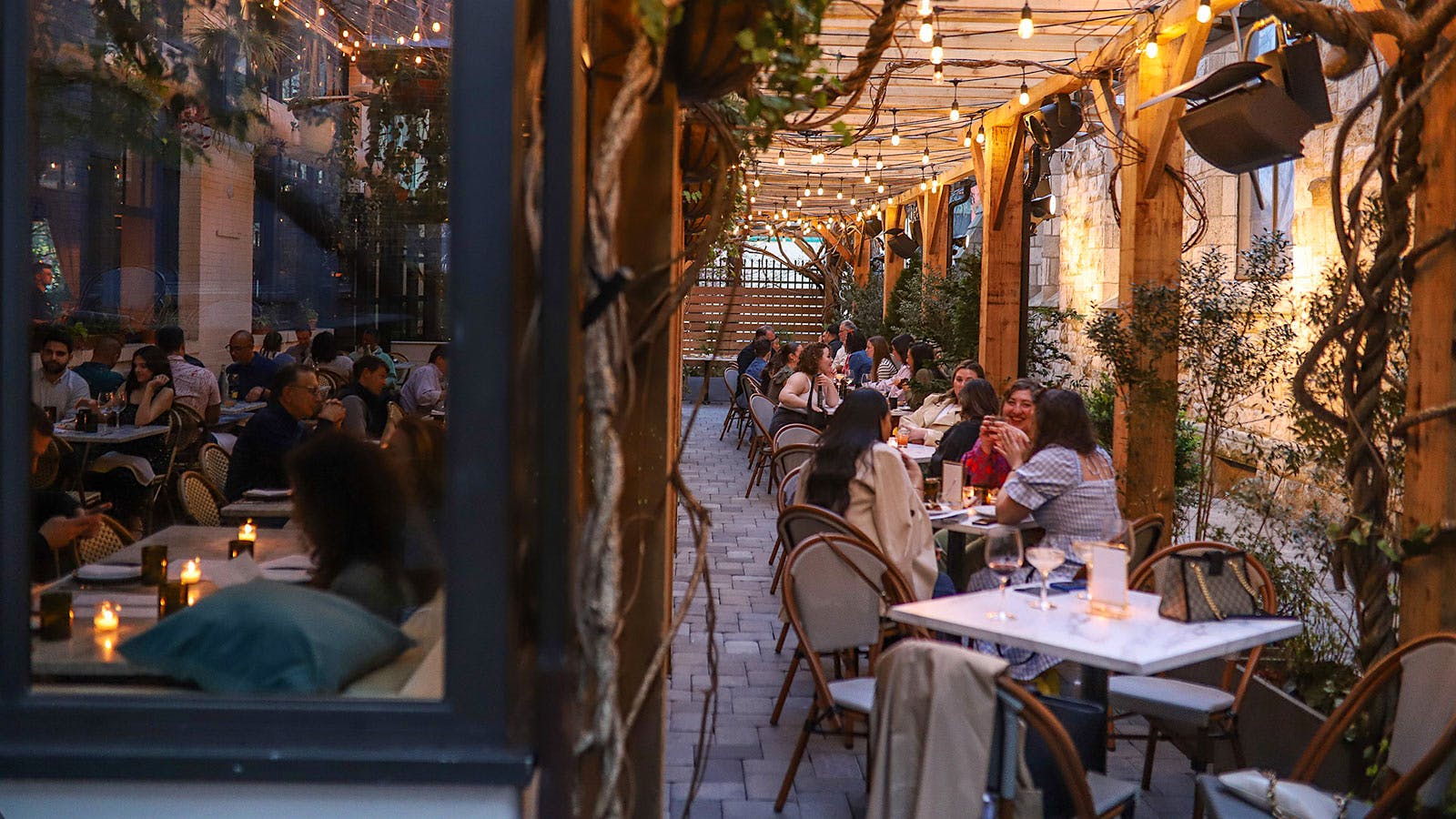  Guests on the patio and in the dining room of Osteria in Philadelphia