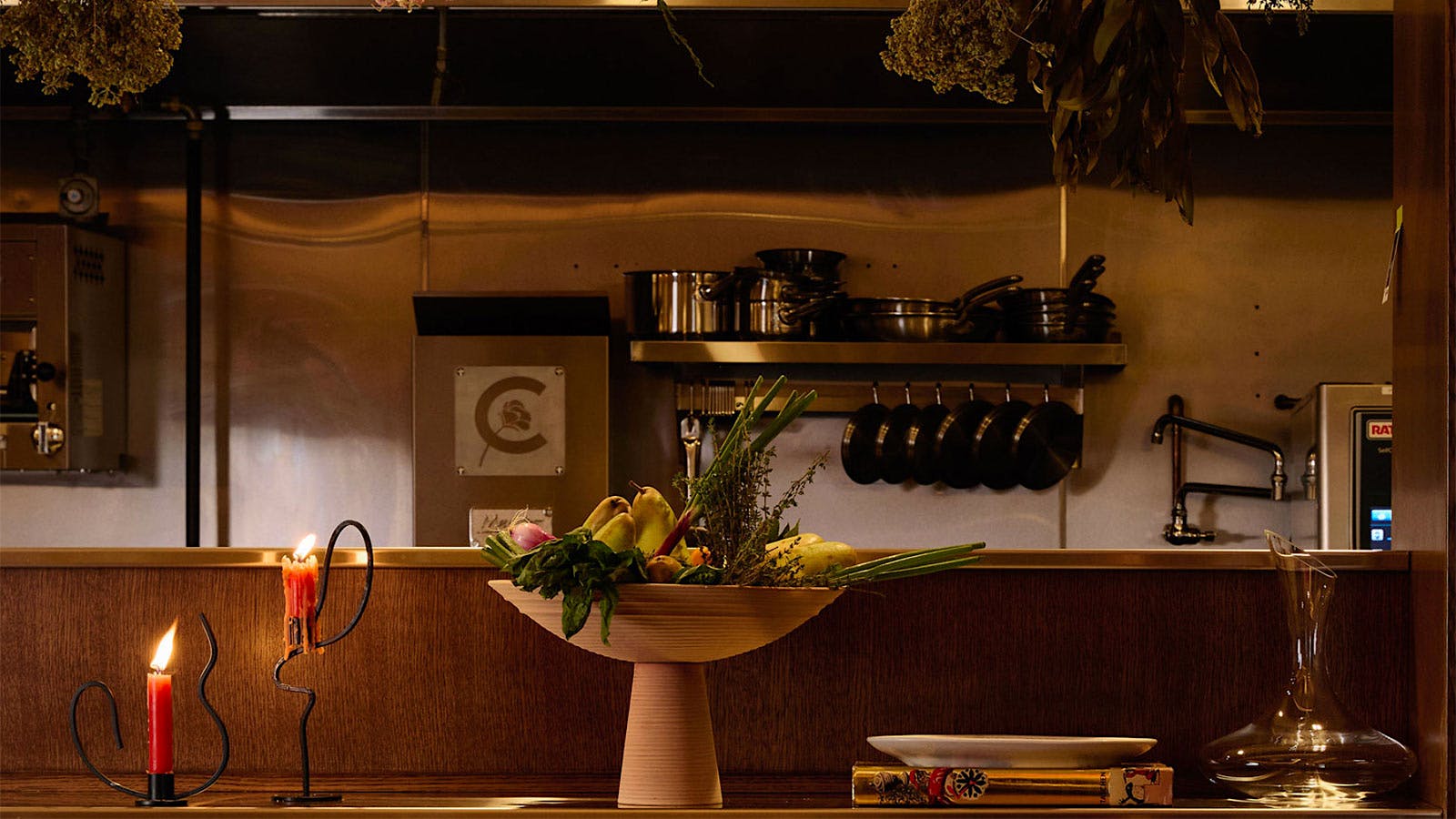  The chef&rsquo;s table at Claudine decorated with hanging dried flowers