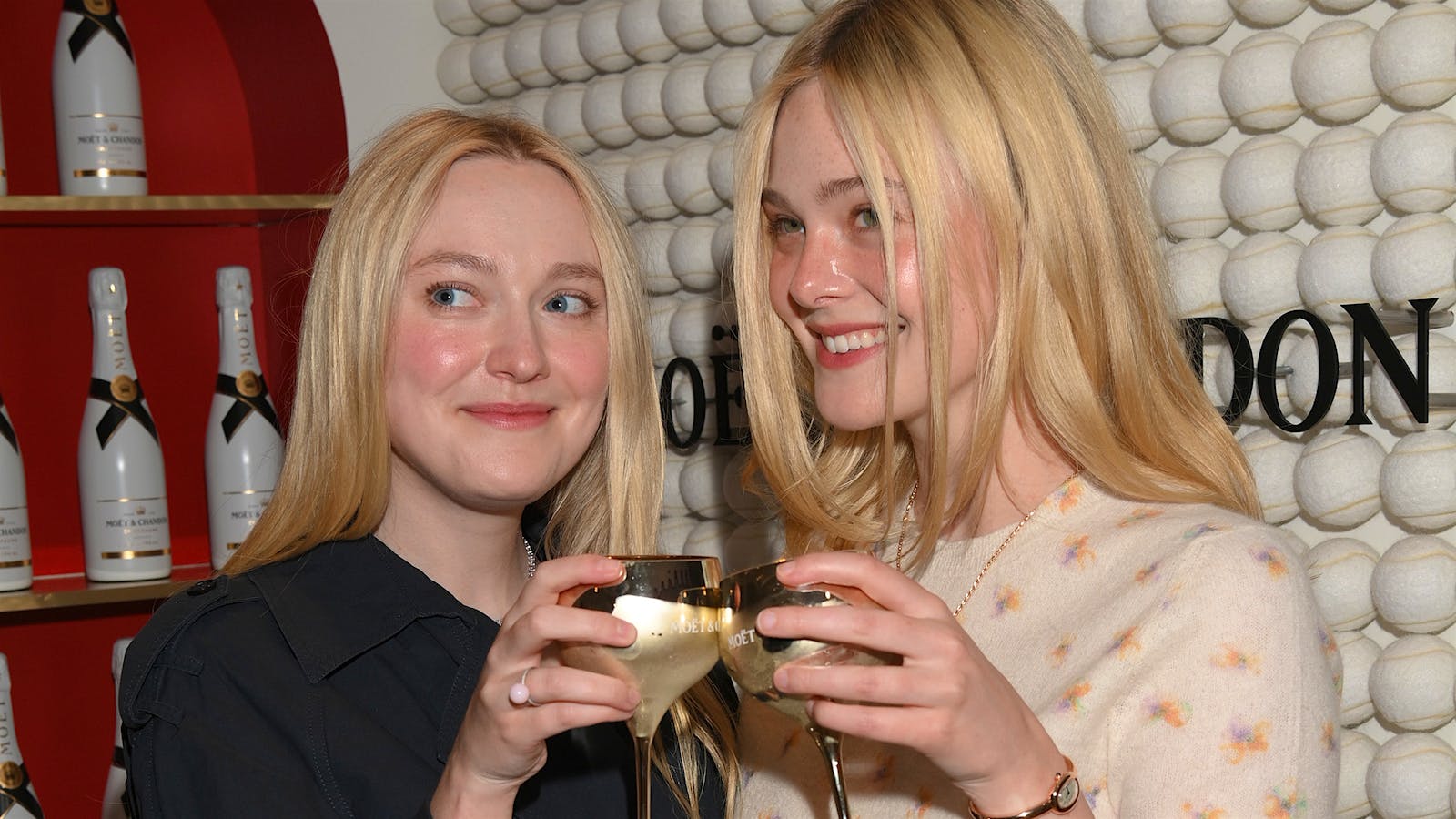  Dakota and Elle Fanning raised their Golden Goblets in the Mo&euml;t &amp; Chandon suite at the U.S. Open.