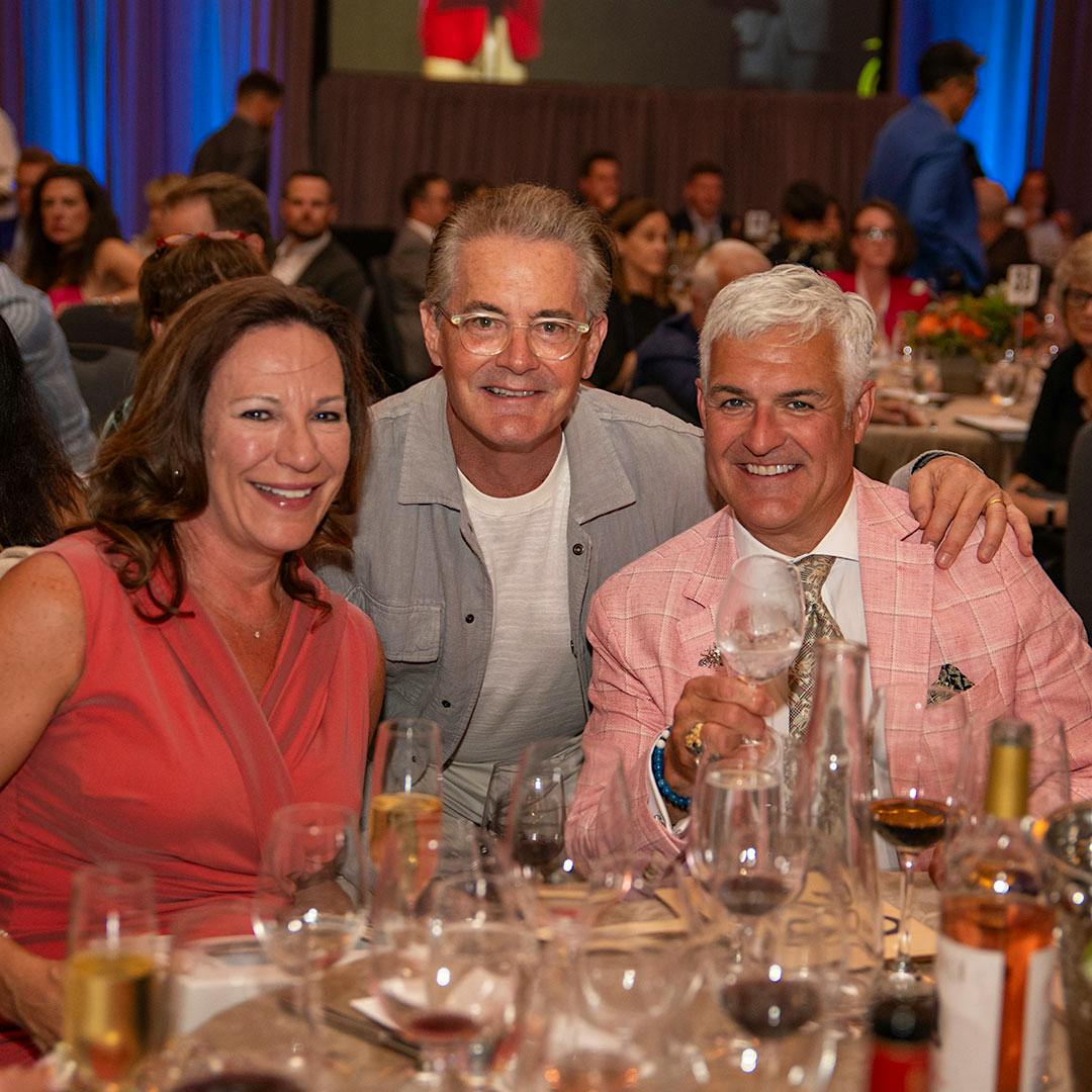 Kyle MacLachlan with Laura and Ian MacNeil, a board member of the 2026 Auction of Washington Wines.