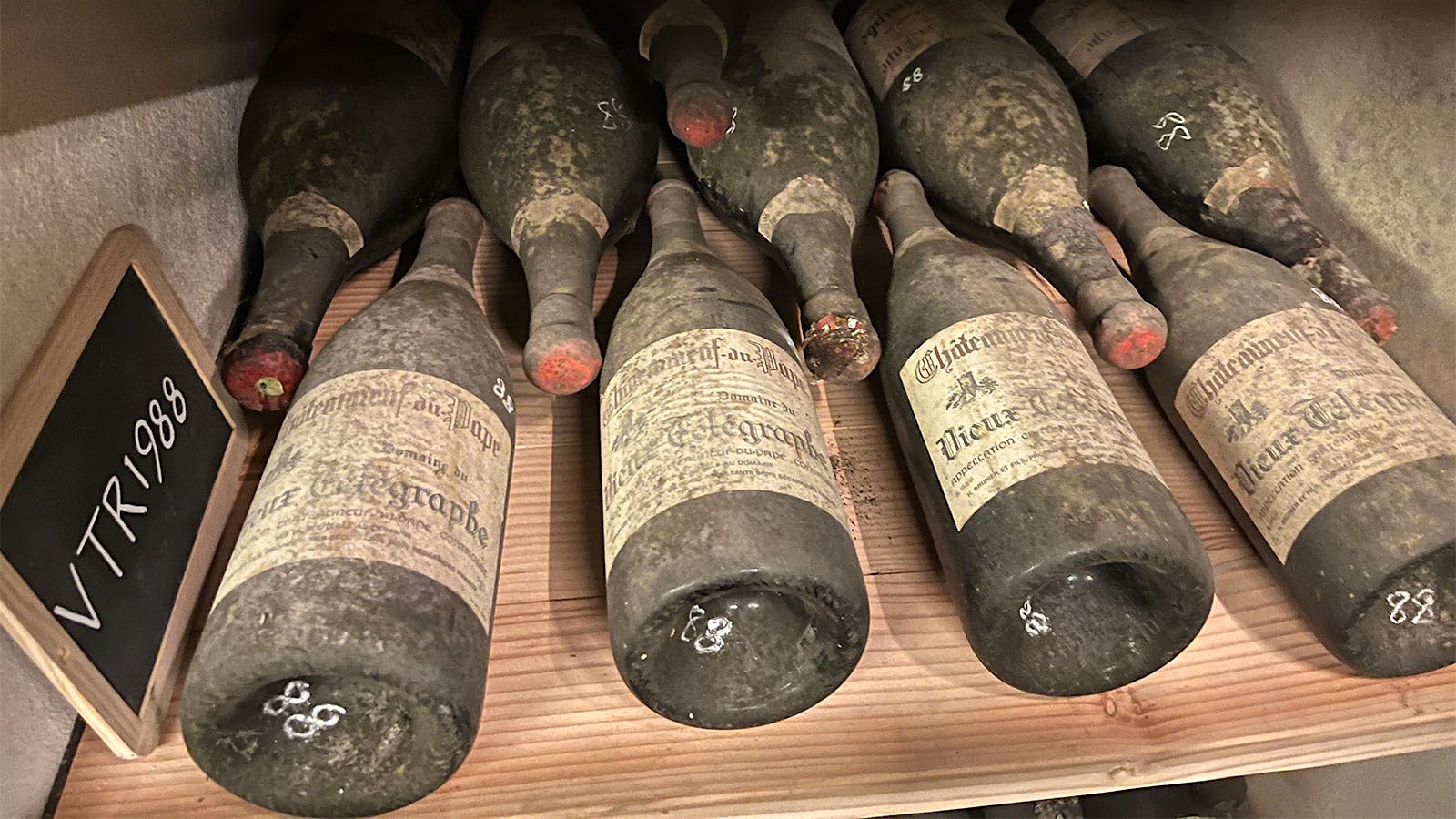  Winegrower Aim&eacute; Sabon grilling on a terrace near Domaine de la Janasse.