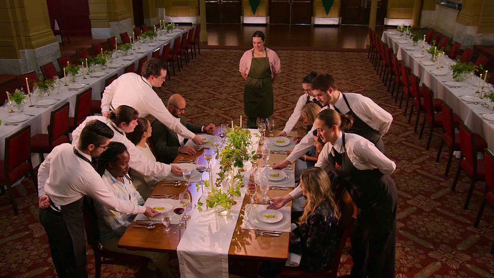 A&nbsp;contestant serving a dish in front of the judges on 'Next Gen Chef'.