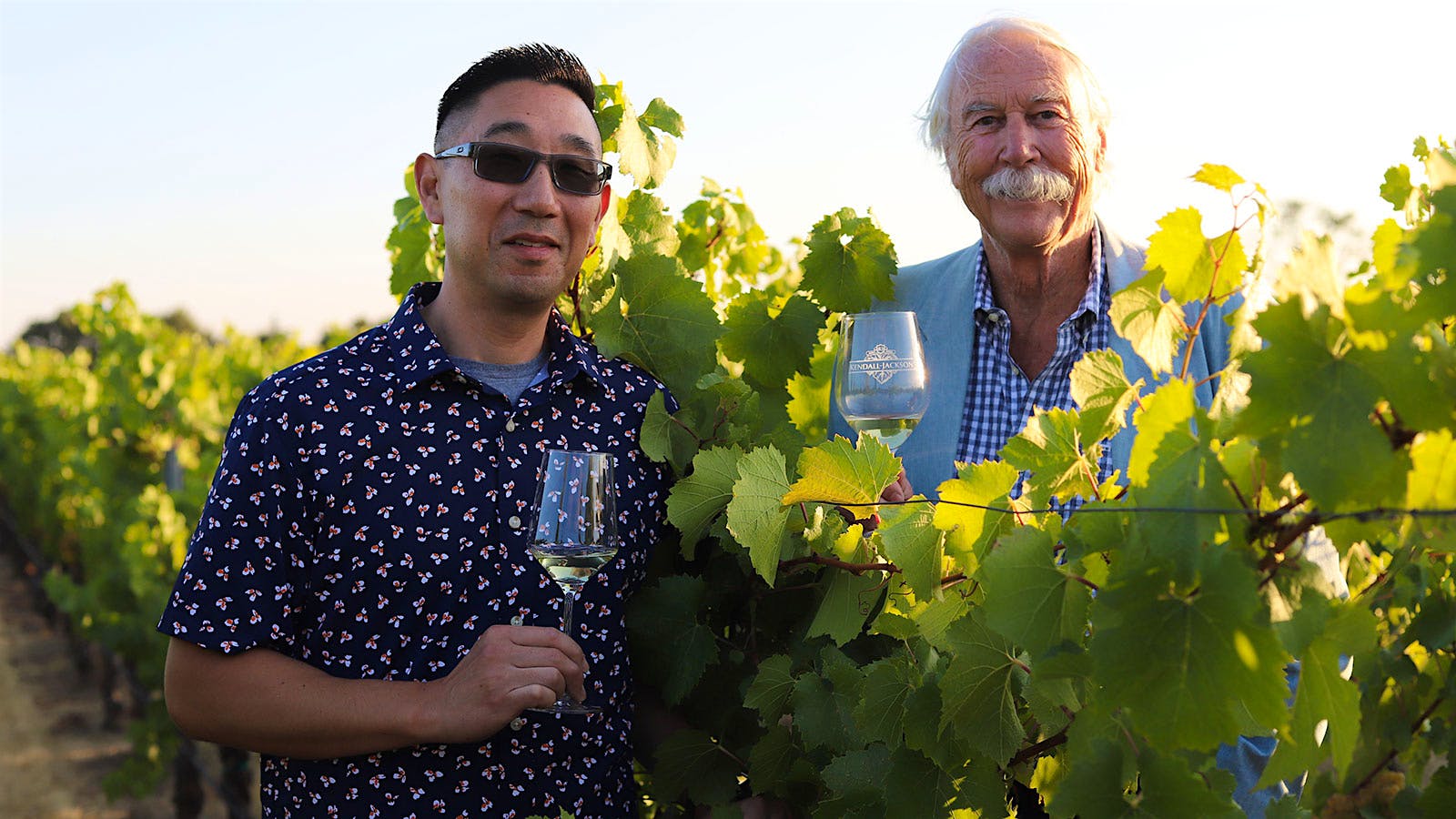  Kris Kato and Randy Ullom in a vineyard.