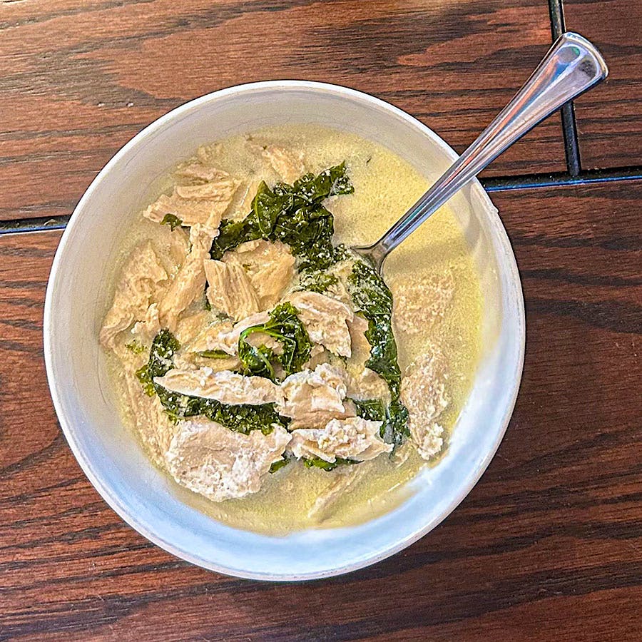 A bright, dry white wine will work well with the savoriness and salinity of the soup, but so will a vermouth!