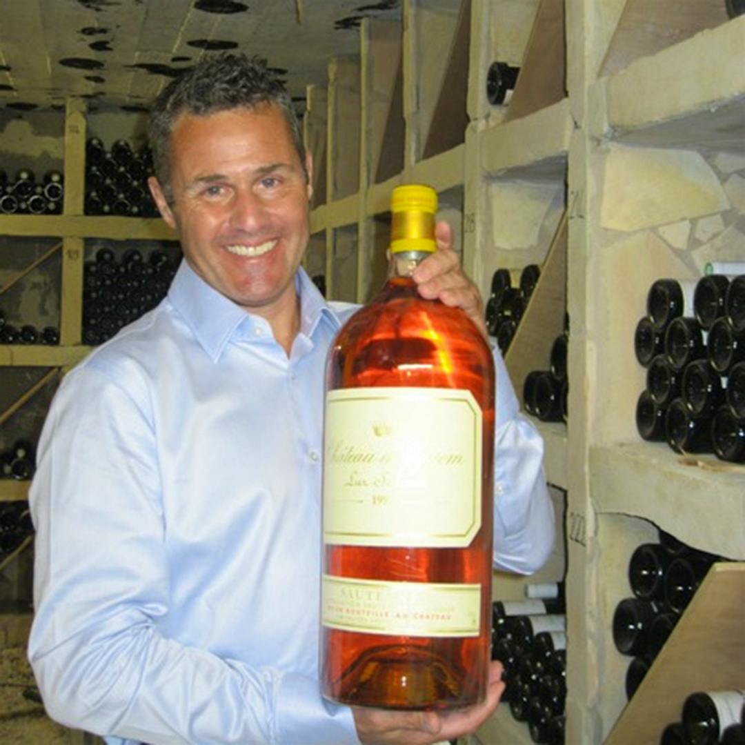  Stephen Burton poses with a large-format bottle of Sauternes.