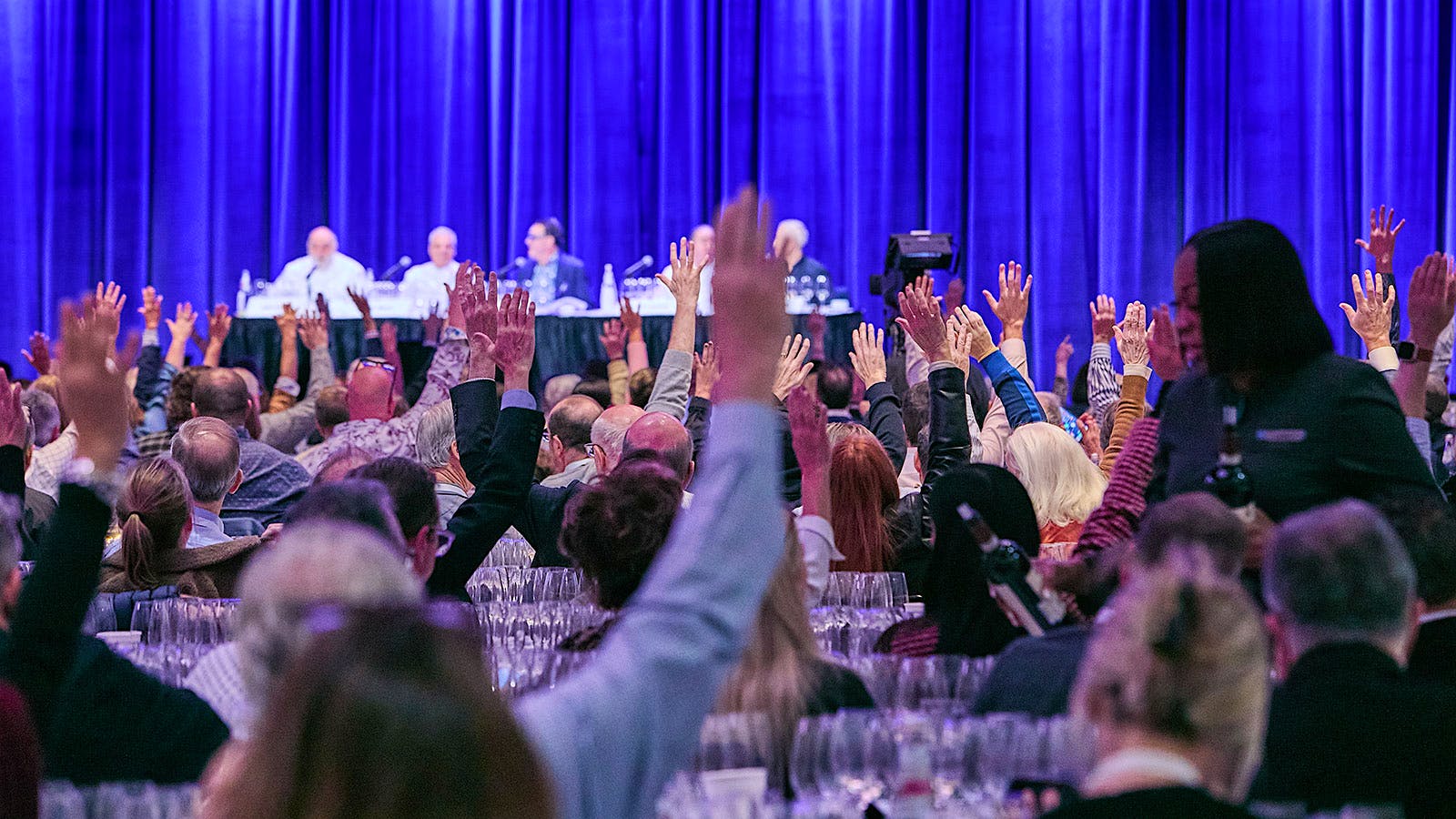  Audience raising their hands during New York Wine Experience