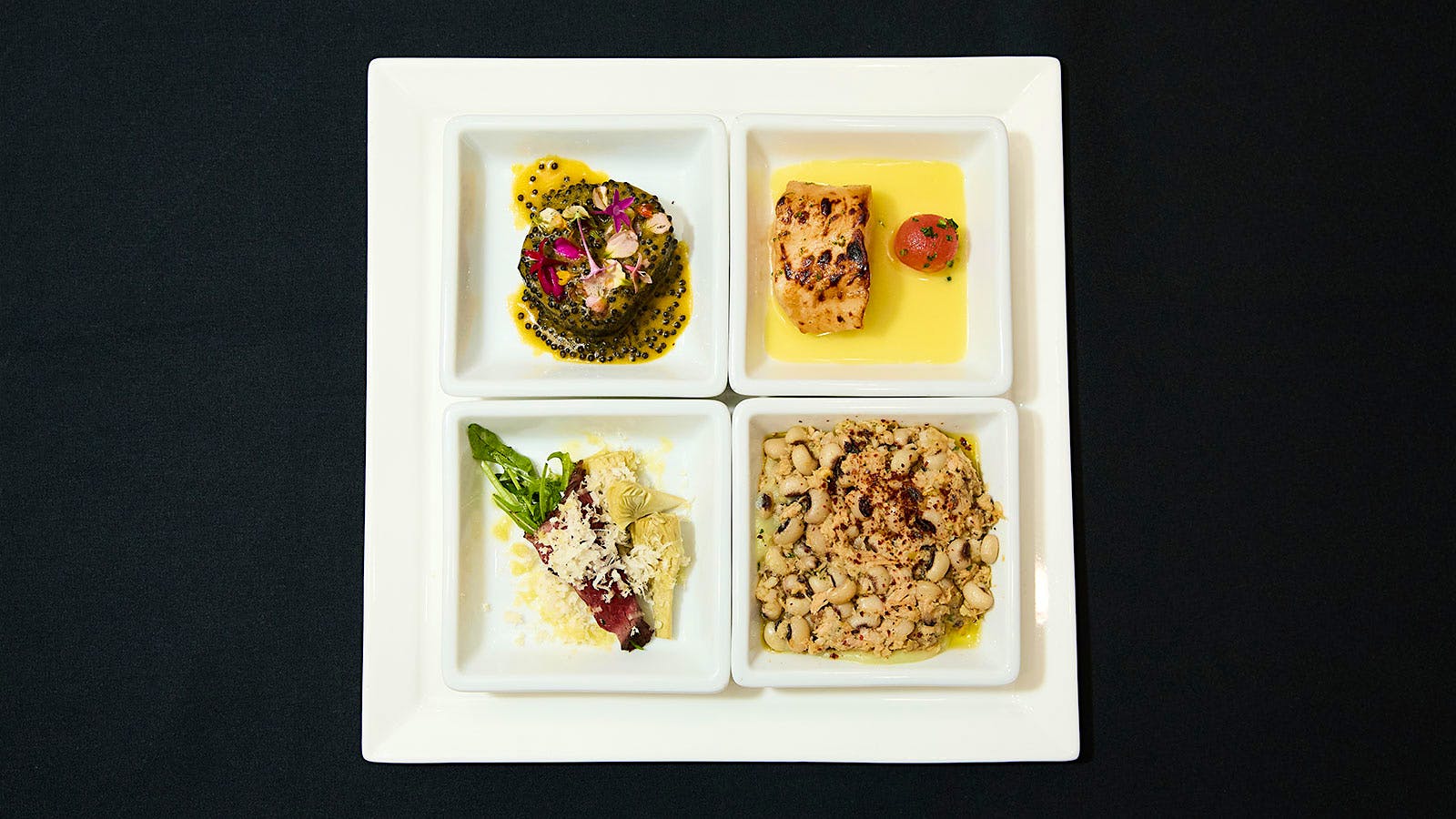  A plate with dishes, clockwise from top left: Jos&eacute; Andr&eacute;s&rsquo; braised leeks, Eric Ripert&rsquo;s miso cod, Emeril&rsquo;s black-eyed pea salad, Danny Meyer&rsquo;s beef carpaccio