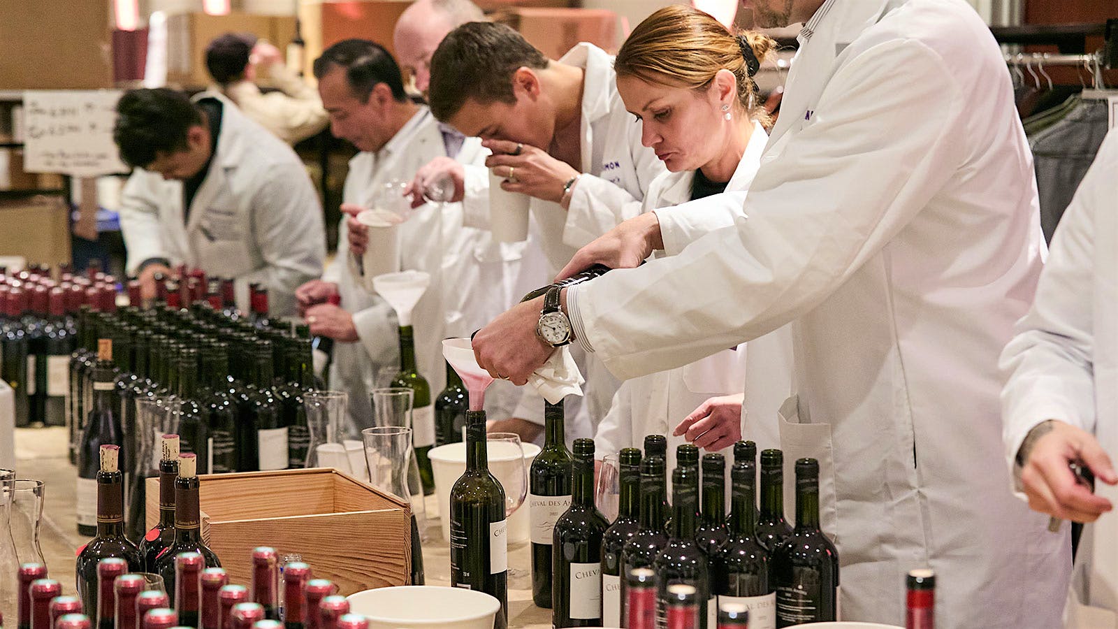  Top sommeliers open and check wines at the 2025 New York Wine Experience at the New York Marriott Marquis.