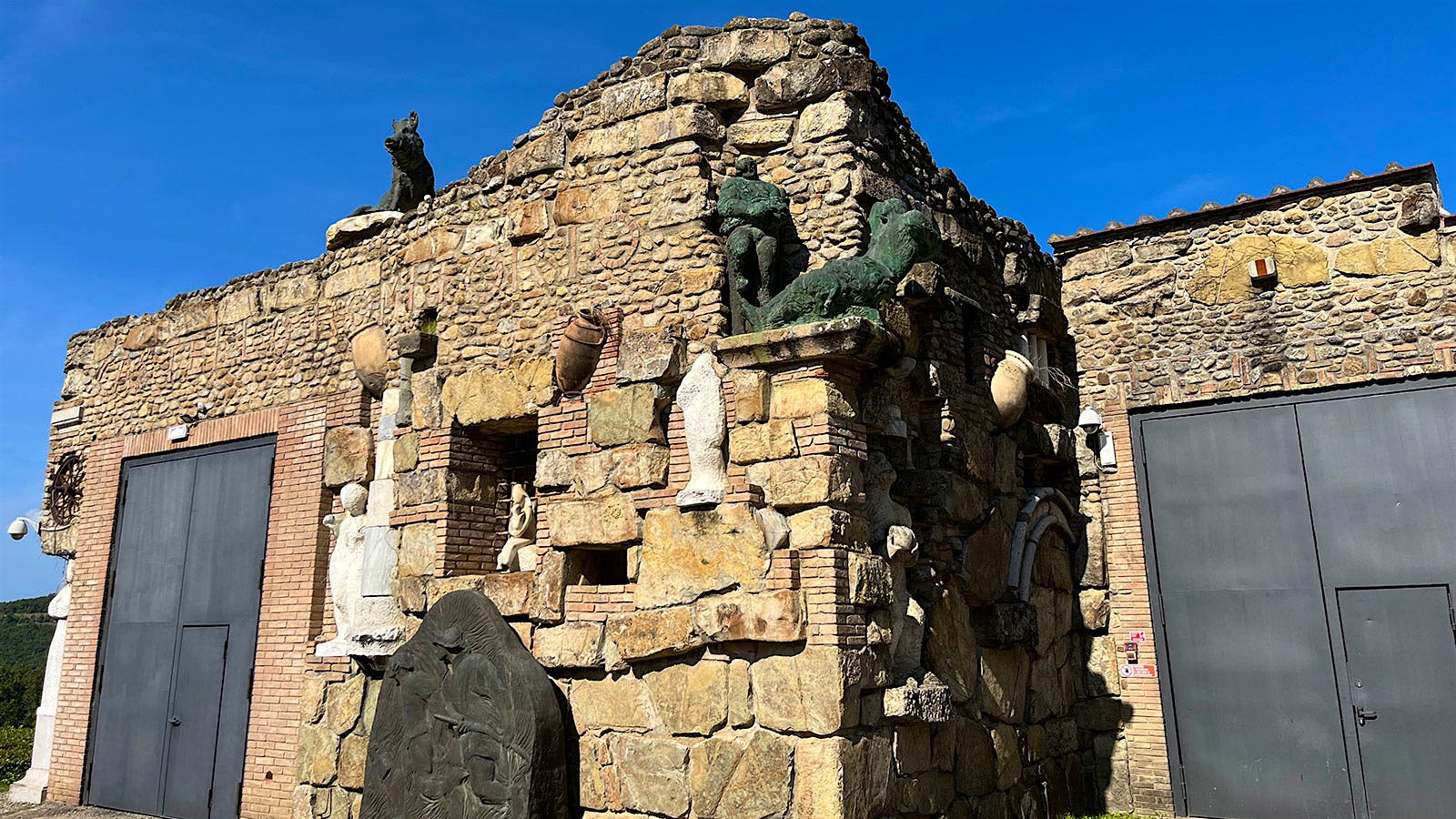 Castello Romitorio's modern winery is disguised by an ancient-looking facade decorated with sculptures by owner and renowned Italian artist Sandro Chia.