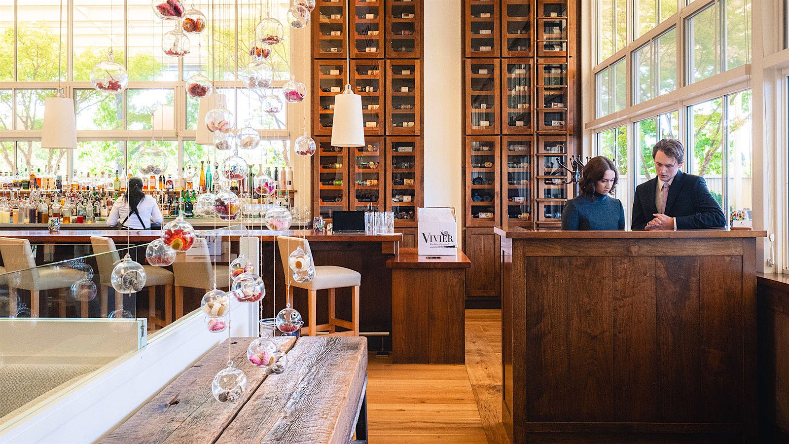  The entrance to Press in Napa Valley, with hanging decorations and a display with wine