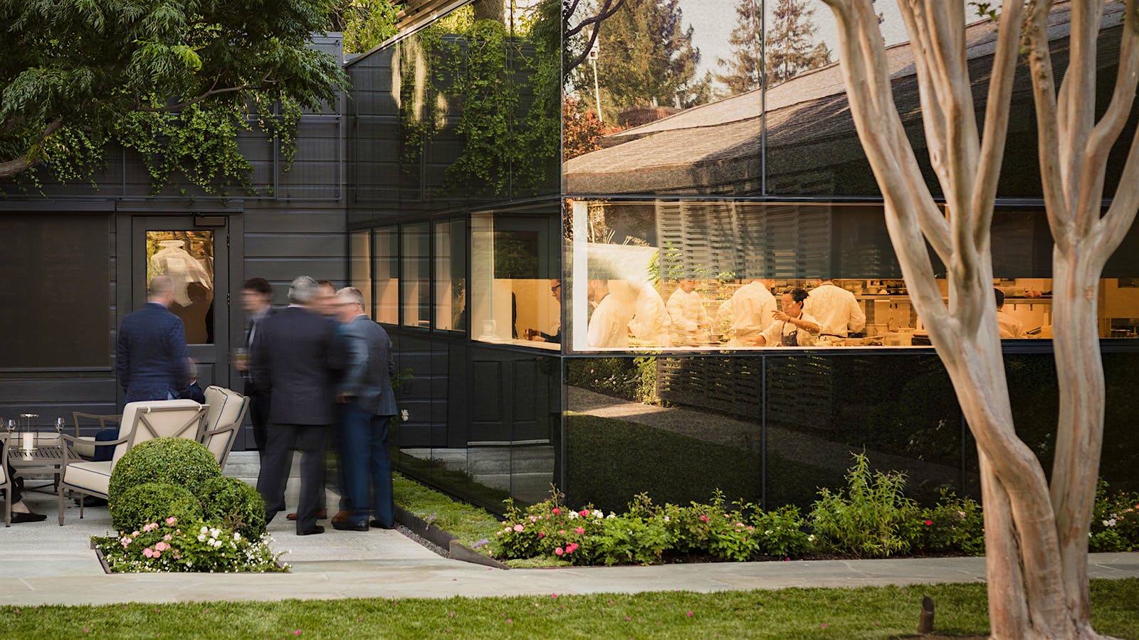  The exterior of the French Laundry in Napa Valley, with a window that looks into the kitchen