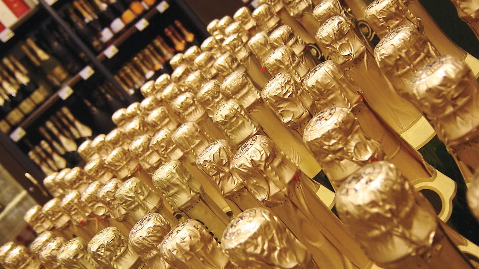 Sparkling wine bottles with gold foil capsules