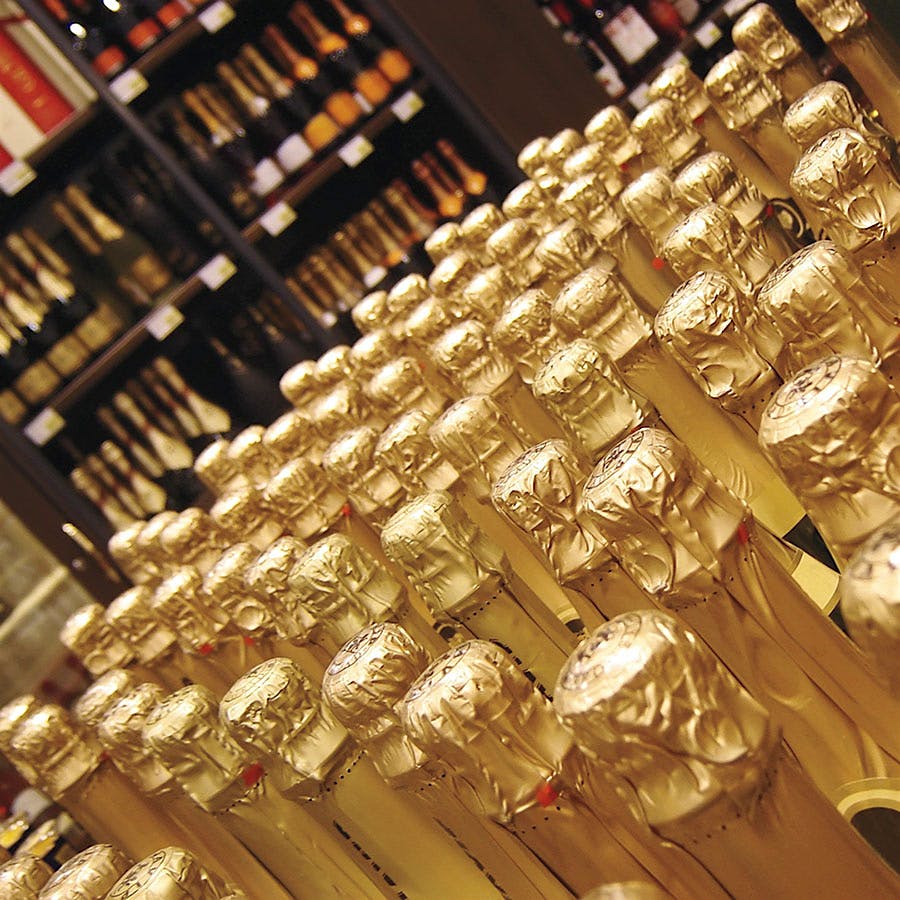 Sparkling wine bottles with gold foil capsules
